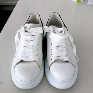 Alexander McQueen women’s oversized sneaker in white/black